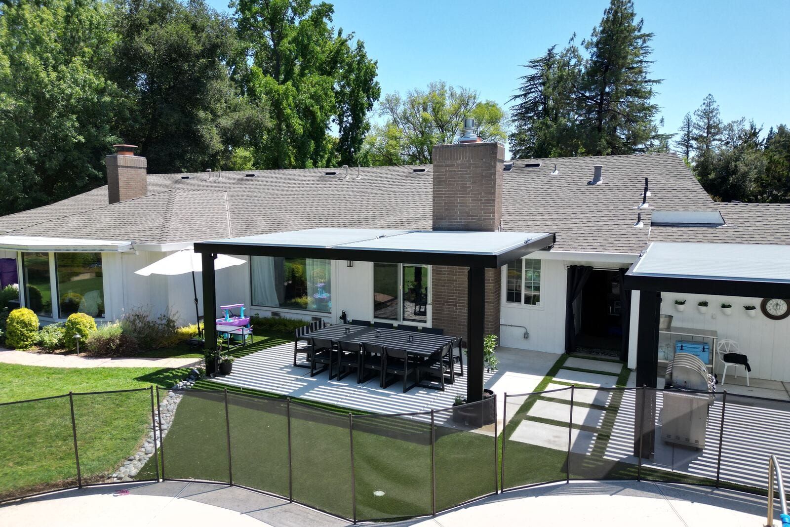 Outdoor living space with kitchen, fireplace, and patio in Sacramento